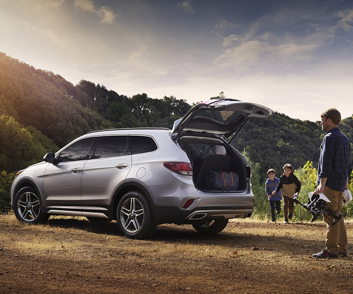 Exterior photo of Hyundai 2018 Santa Fe XL SUV’s trunk opening hands ...